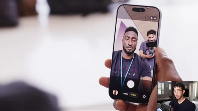 A person uses the iPhone's front camera to take a selfie, demonstrating the new feature for automatic landscape conversion from vertical capture