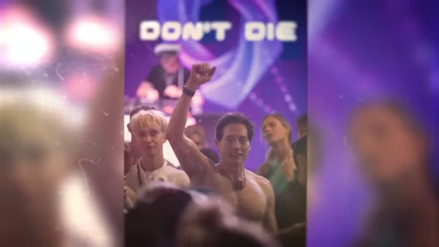 A crowd at an event with the 'Don't Die' logo displayed, symbolizing the movement