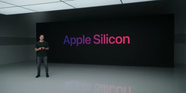 John Ternus, SVP of Hardware Engineering, presenting with Apple Silicon in the background