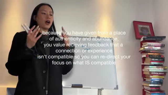 Text overlays the speaker, explaining that giving from authenticity and abundance allows one to value feedback, even if it signifies incompatibility, to redirect focus.