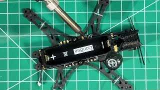 Soldering the motor wires directly to the large pads on the flight controller, which is crucial for maximizing power transfer.