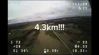 The FPV feed displays the maximum distance achieved during the second long-range test: 4.3 kilometers.