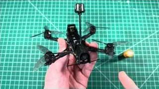 The assembled NewBeeDrone LionBee drone is held up, emphasizing its design and functionality.