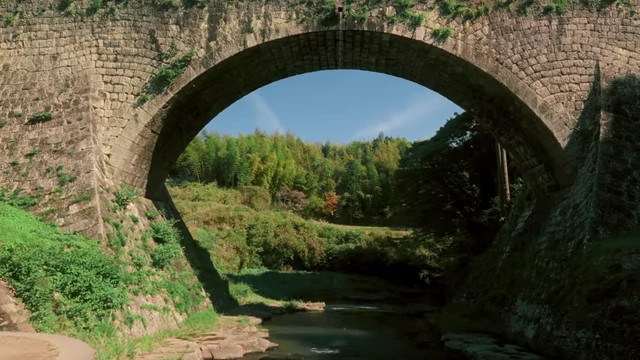 The historic Tsujun Bridge, Japan's largest stone aqueduct, showing its impressive arch