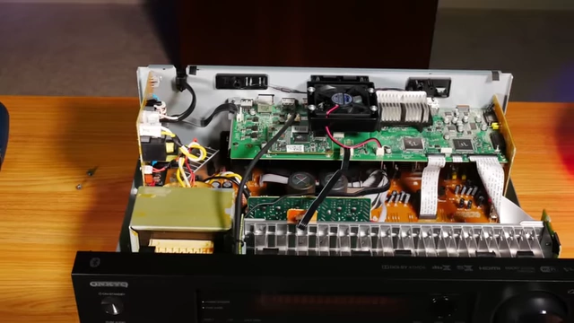 Internal view of the Onkyo TX-NR6050 showing the fan and heatsinks