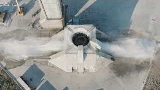 Water deluge system on the top deck of the Starship launch mount in action.