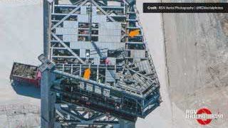 An aerial view of the tower's roofing structure undergoing modifications and reinforcement.