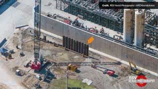 Sheet piles being installed, indicating the construction of a blast wall in the tank farm.