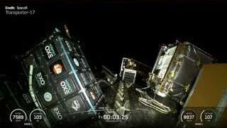 Multiple small satellites being deployed from the Transporter-17 mission's deployment structure in orbit.