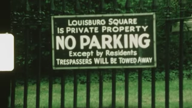 A sign with text against a metal fence states "LOUISBURO SQUARE IS PRIVATE PROPERTY NO PARKING Except by Residents TRESPASSERS WILL BE TOWED AWAY", suggesting clear boundaries and rules.