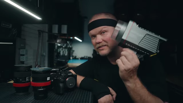 The speaker demonstrates the Aputure 200X bi-color light, recommended for basic setups.