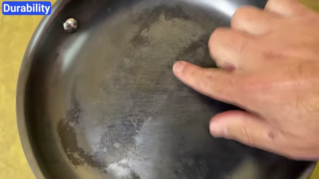 Close-up of light scuff marks on a pan after rigorous metal utensil testing.