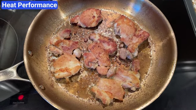 Chicken pieces browning evenly across the entire surface of the Strata pan.