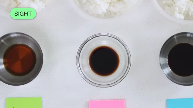 Three bowls with different shades of soy sauce, ranging from light brown to very dark.