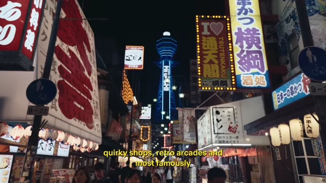 The vibrant, neon-lit streets of the Shinsekai entertainment district with the illuminated Tsutenkaku tower in the background, creating a retro atmosphere.