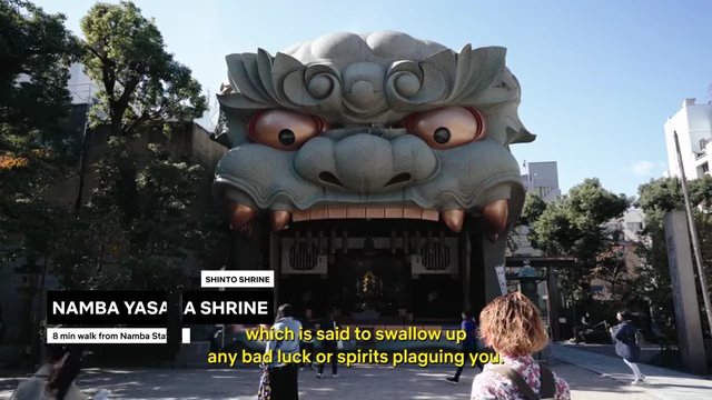 The iconic large lion head stage at Namba Yasaka Shrine.