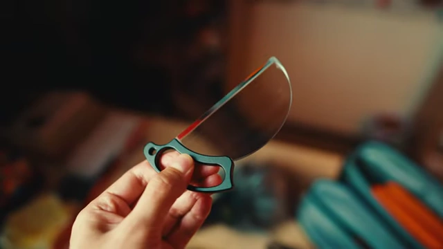 A handheld split diopter filter with an attached handle