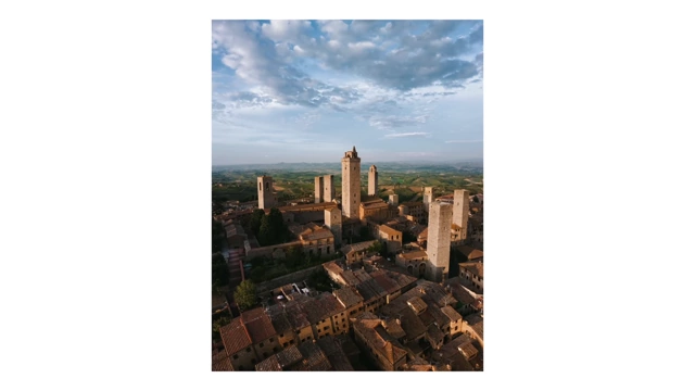 An aerial view of a historic European town at golden hour