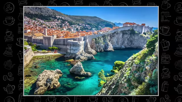 The historic city walls of Dubrovnik, Croatia, overlooking crystal blue waters.