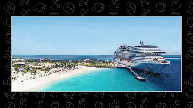 A large cruise ship docked beside a tropical beach.