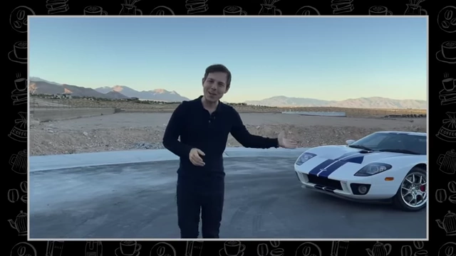 Graham Stephan poses next to a white Ford GT with blue racing stripes.