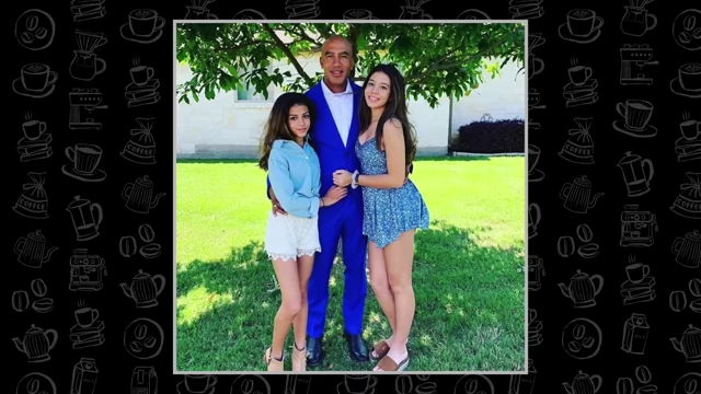 Bill Perkins poses with his two daughters under a tree.