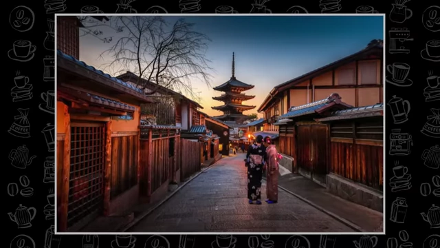 A scenic street in Kyoto, Japan, with traditional wooden buildings and a pagoda in the distance.