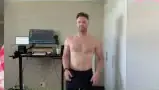 The presenter looking at his physique in the mirror.