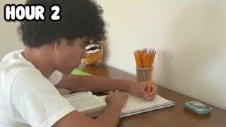 A close-up of the presenter writing notes with a pencil, with the text "HOUR 2" overlaid.