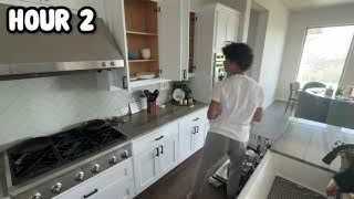 The presenter carefully putting away dishes from a dishwasher into cabinets, with the text "HOUR 2" overlaid.