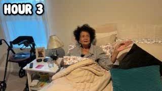 The presenter's grandmother sitting up in bed, with the text "HOUR 3" overlaid.