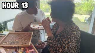 The presenter serving chicken nuggets to his grandmother, who is eating at a table.