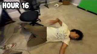 The presenter lying spread-eagle on the floor next to his office chair, with the text "HOUR 16" overlaid.