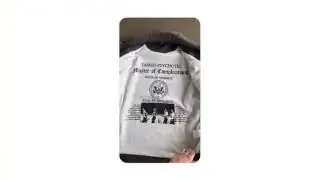 A white t-shirt with a detailed graphic referencing "TAME PSYCHOTIC" and military-like motifs.