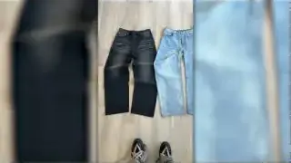 Two jeans of different washes laid flat, indicating different versions of a product.
