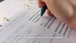 Close-up of goal tracking checkboxes in a journal