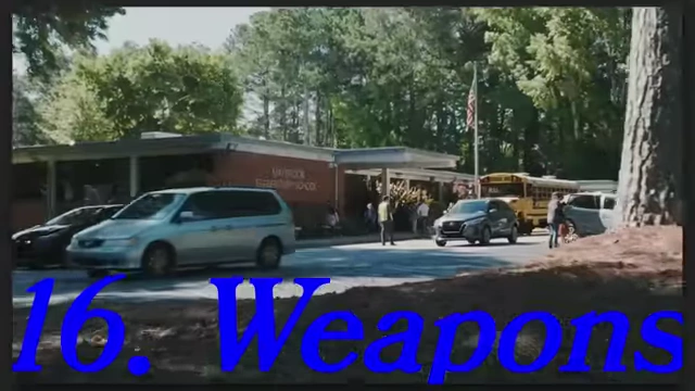 A school building with cars and buses parked outside in "Weapons."