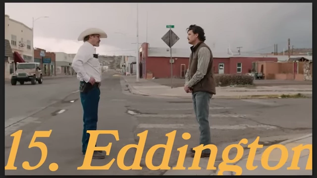 Two men standing in the middle of a street in a small town from "Eddington."