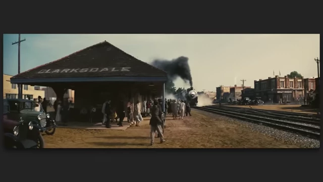 A train arriving at the "Clarksdale" station, evoking historical blues and black culture in "Sinners."