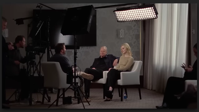An older director (Stellan Skarsgård) and a young American actress (Elle Fanning) being interviewed on set in "Sentimental Value."