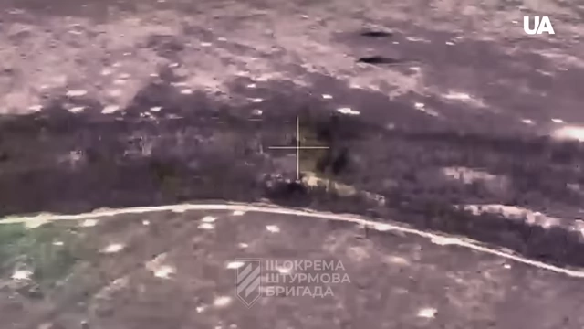 A thermal vision view from a drone targeting a wooded area
