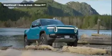 Rivian R1T by a lake