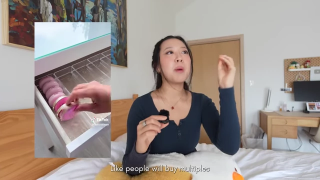 A social media video showing multiple organized macarons in a drawer, illustrating the trend of buying excessive multiples.