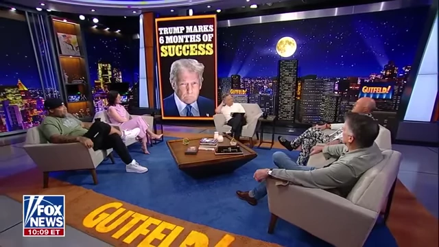 A panel discusses Trump's six months of success with a large graphic of Trump and "Trump Marks 6 Months of Success" in the background.