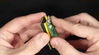 The SIDKick Pico board with header pins and a Raspberry Pi Pico attached, forming a compact module.