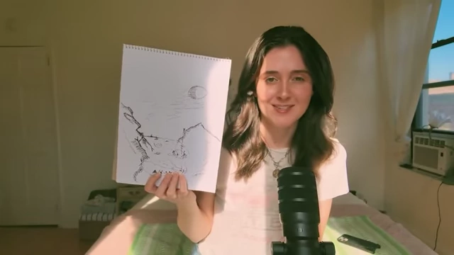 Anna shows a pen drawing she created during her media break