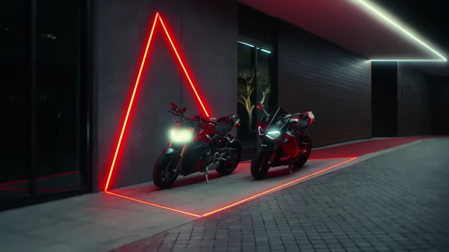 Motorcycles in a scene with intentional red lighting for color composition