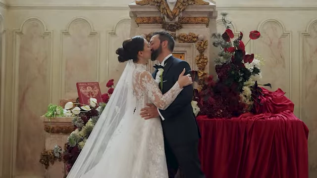 Derek Muller and his wife sharing a kiss at their wedding, symbolizing a personal milestone achieved with improved work-life balance.