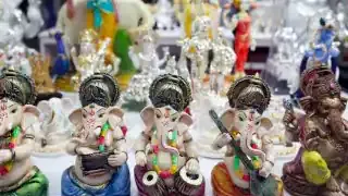 Hindu devotional statues displayed in a Singaporean shop, illustrating the preference for "Made in India" items.