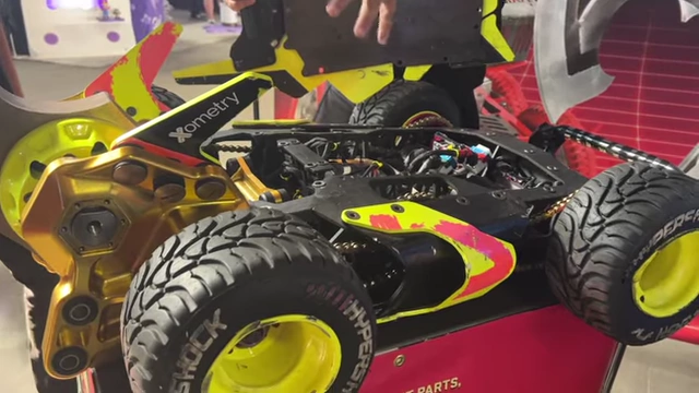An RC car with exposed internal components.